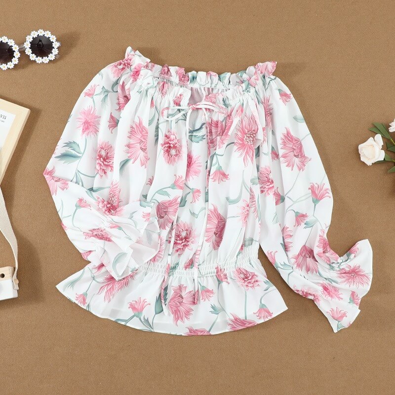 Blomstret bluse med volanger